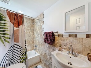 Shower, towels, soap, toilet paper