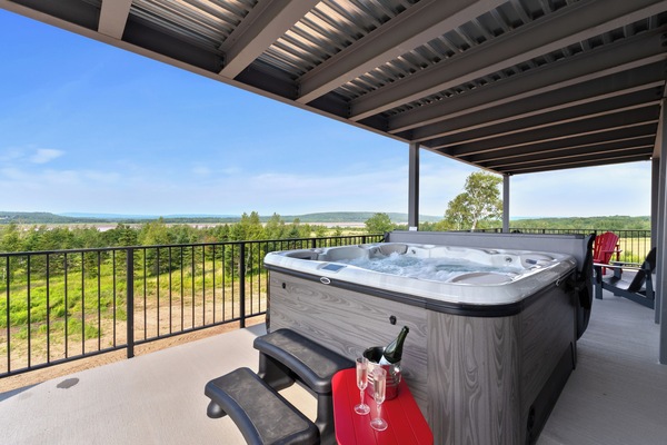 Spacious covered patio featuring our 8 person hot tub.