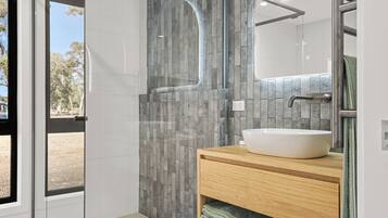 Separate bathtub and shower, hair dryer, bathrobes, slippers