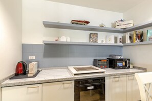 Fridge, microwave, coffee/tea maker, toaster