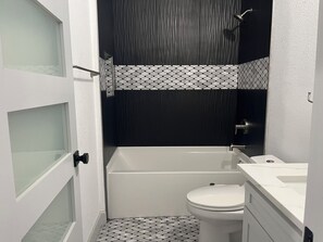 Shower, towels, soap, toilet paper