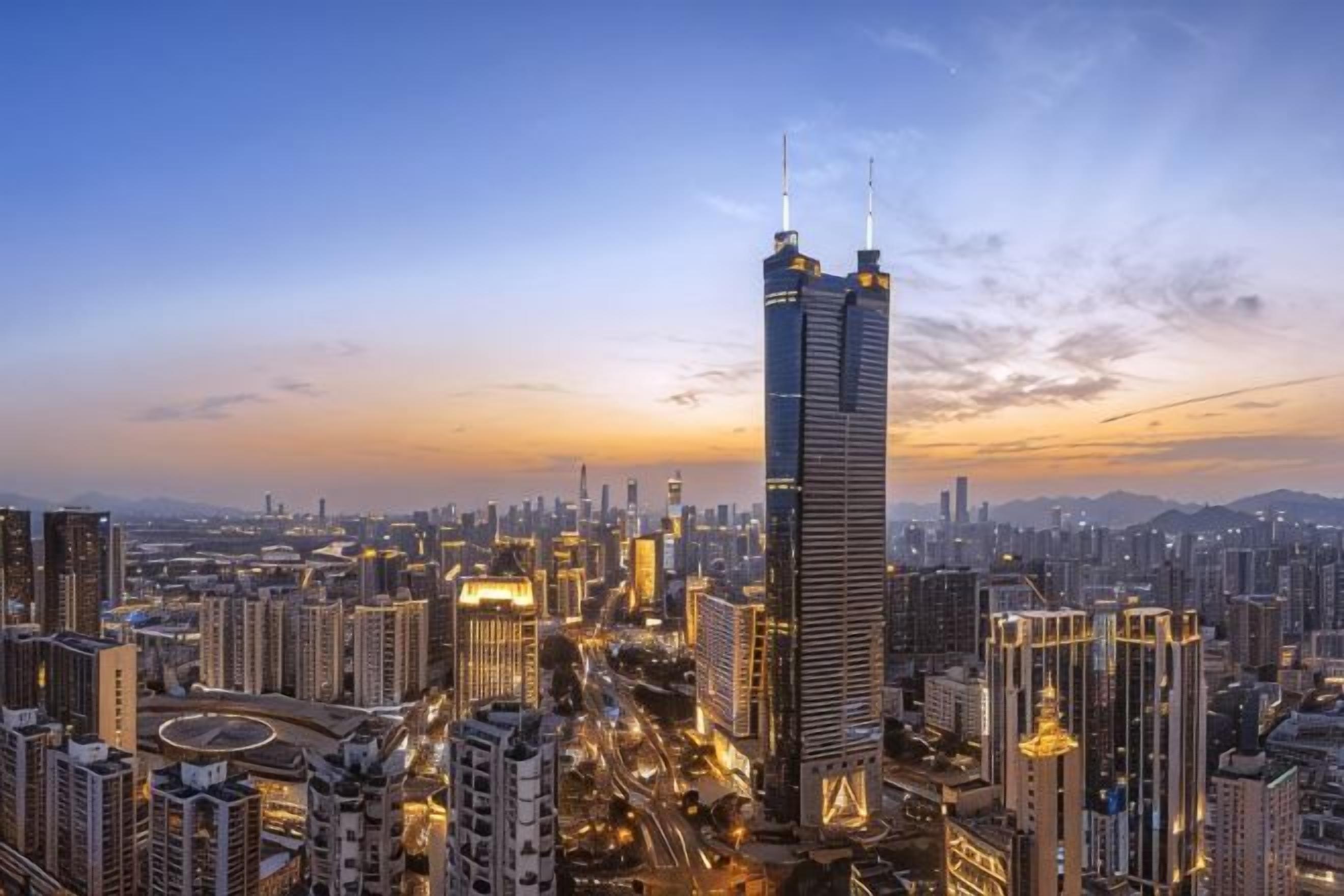 A high-rise building with a distinctive top structure, surrounded by a dense urban skyline.