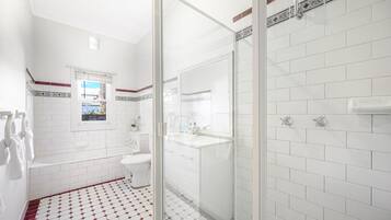 Shower, hair dryer, towels, shampoo