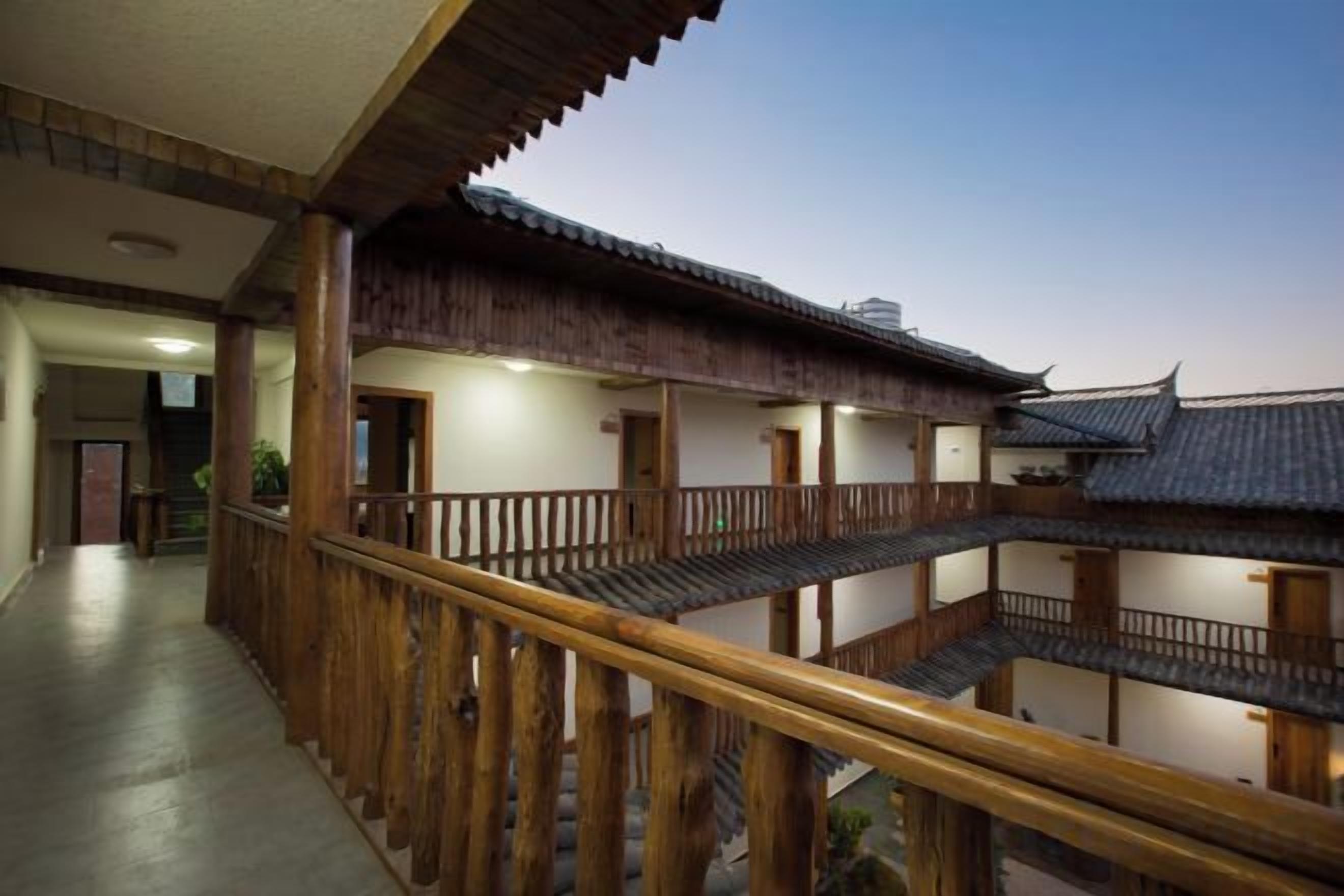 A traditional Japanese-style building with wooden railings and multiple levels.