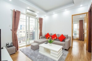 Executive Apartment, City View | Living area | 55-inch flat-screen TV with cable channels - Sumitomo 4- Serviced Apartment  (Hanoi)