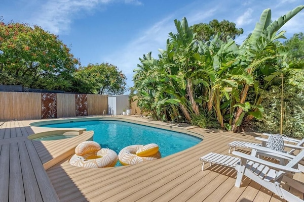 Pool view with deck and outdoor shower