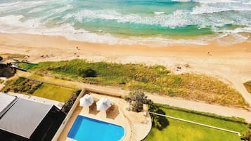 On the beach, sun-loungers, beach towels