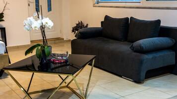 Suite Deluxe, cuisine, rez-de-chaussée | Coin séjour