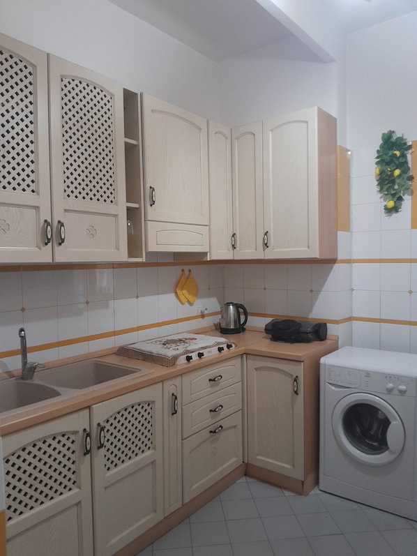 Fridge, microwave, stovetop, coffee/tea maker