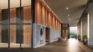 A modern interior with wooden paneling, a glass wall, and a bench.