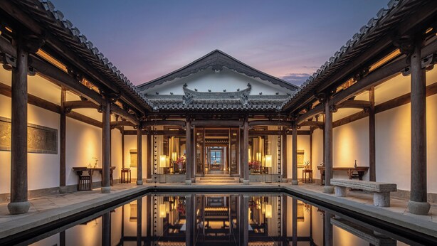 A traditional building with a central courtyard and a reflective pool. - Huangshan Misty Rain Resort Hotel (Huangshan)