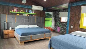 A bedroom with two beds, a wooden headboard, a nightstand, and a shelf with decorative items. - Leon House (Jardines de la Calera)