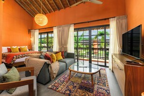 Familien-Doppelzimmer, Mehrere Betten, Balkon, Gartenblick | Wohnbereich