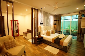 Luxury Suite, Balcony | 1 bedroom, desk, laptop workspace, iron/ironing board