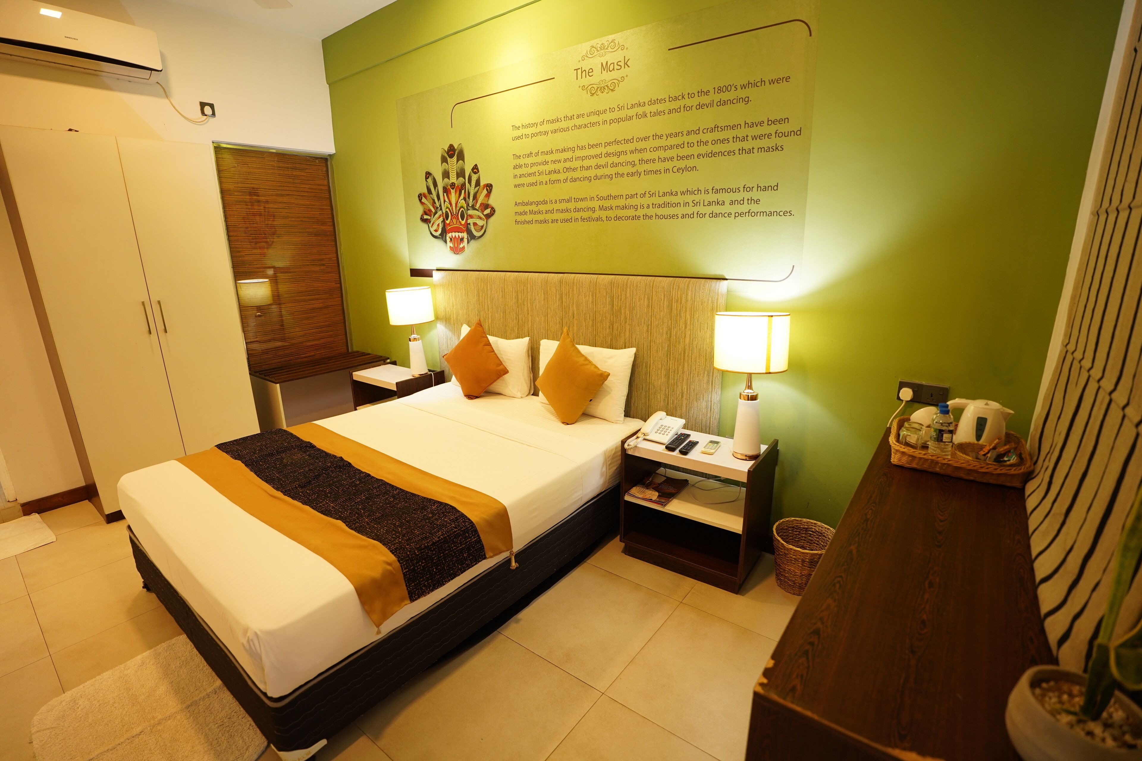 A hotel room with a bed, nightstands, a wall-mounted information board, and a wooden headboard.