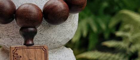 A decorative wooden structure with spherical elements and a carved wooden plaque.