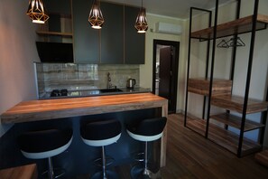Fridge, microwave, stovetop, coffee/tea maker