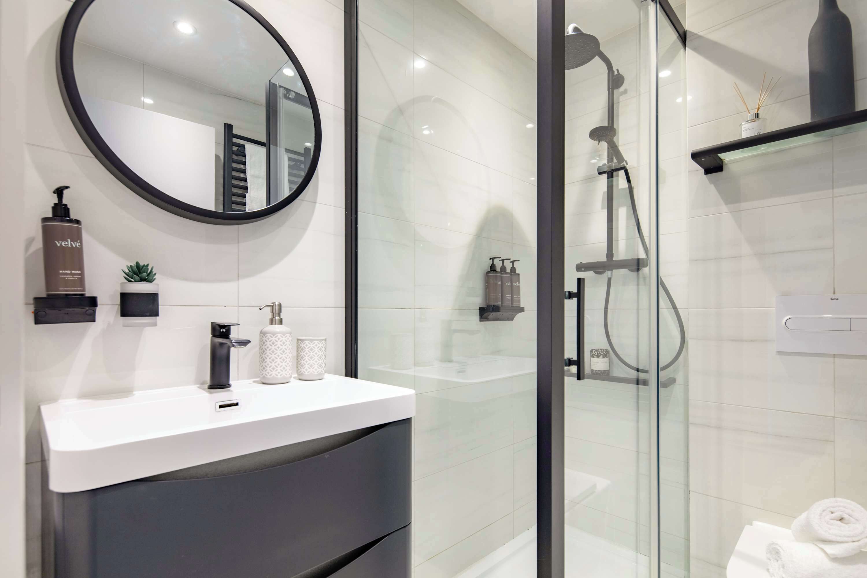 Shower, hair dryer, towels, soap