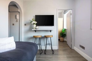 1 bedroom, desk, iron/ironing board, travel cot