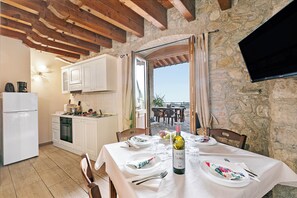 Family Apartment, 2 Bedrooms (Two Bedroom Apartment Cascina) | Living area | 21-inch flat-screen TV with satellite channels