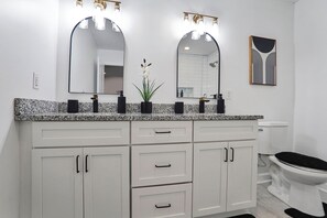 Shower, towels, soap, toilet paper
