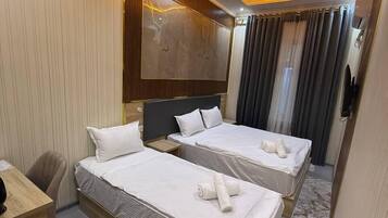 Premium bedding, desk, laptop workspace, free WiFi