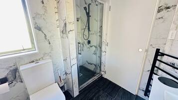 Shower, hair dryer, towels, soap