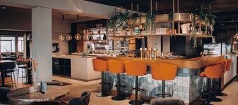 Luxury room with a balcony overlooking De Gouden Ham, offering modern amenities and a serene, picturesque setting.