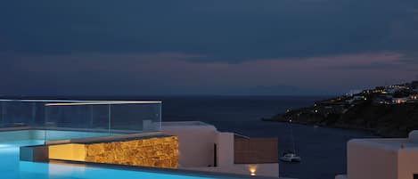 Seasonal outdoor pool, open 11:00 AM to 9:00 PM, pool umbrellas