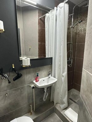 Shower, towels, soap, shampoo