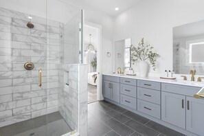 Shower, hair dryer, towels, shampoo