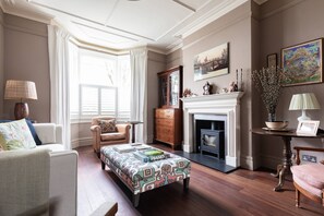 Apartment (4 Bedrooms) | Living area | TV, video-game console - Caithness Road VI by Onefinestay (London)