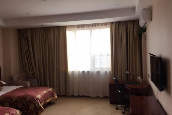 A hotel room with two beds, a desk, a chair, a TV, and a large window with curtains. - Zhoushan Perfect Business Hotel (Zhoushan)