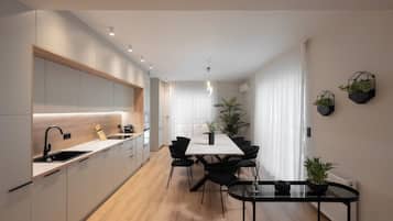 Deluxe Apartment, 4 Bedrooms, City View | Dining room