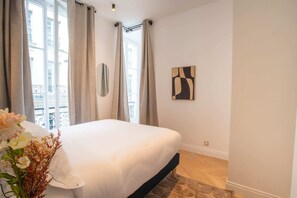 1 bedroom, desk, iron/ironing board, travel crib