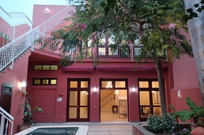 Experience the perfect blend of modern and traditional architecture, with a vibrant facade and lush surroundings.