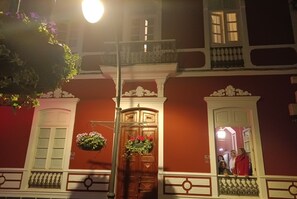 Traditional building with ornate moldings and a classic symmetrical design.
