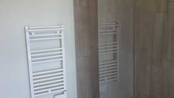 Shower, towels, soap, toilet paper