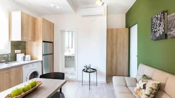 Comfort Apartment, Balcony, Beach View | Living area | Flat-screen TV