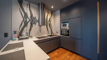 1+1 Superior Suite (All rooms have different design) | Private kitchen | Highchair, dining tables