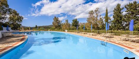 Outdoor pool, open 9:30 AM to 6:30 PM, pool umbrellas, sun loungers