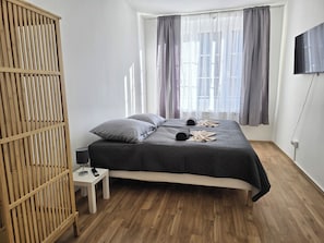 Deluxe Apartment, 2 Bedrooms, Kitchen, City View | Laptop workspace, blackout drapes, soundproofing, iron/ironing board