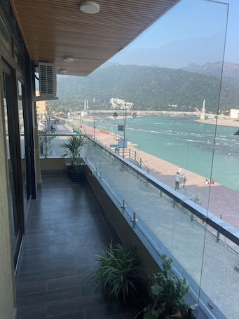 Triple Room, River View | Balcony. Maayaa inn by Ganges