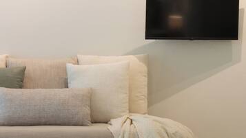 Grand Family Suite | Living area | 32-inch Smart TV with digital channels