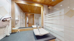 Shower, hair dryer, towels, toilet paper