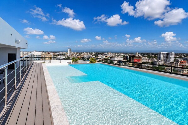 A rooftop pool with a clear view of the cityscape.
