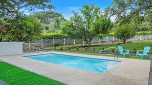 Outdoor pool, open 8:00 AM to 8:00 PM, pool loungers