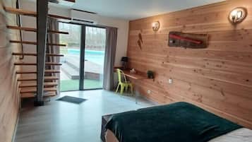 Family Room, Pool View | Desk, laptop workspace, soundproofing, free WiFi