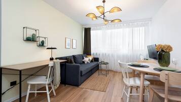 Comfort Apartment, City View | Living area | 50-inch Smart TV with cable channels, Netflix, streaming services