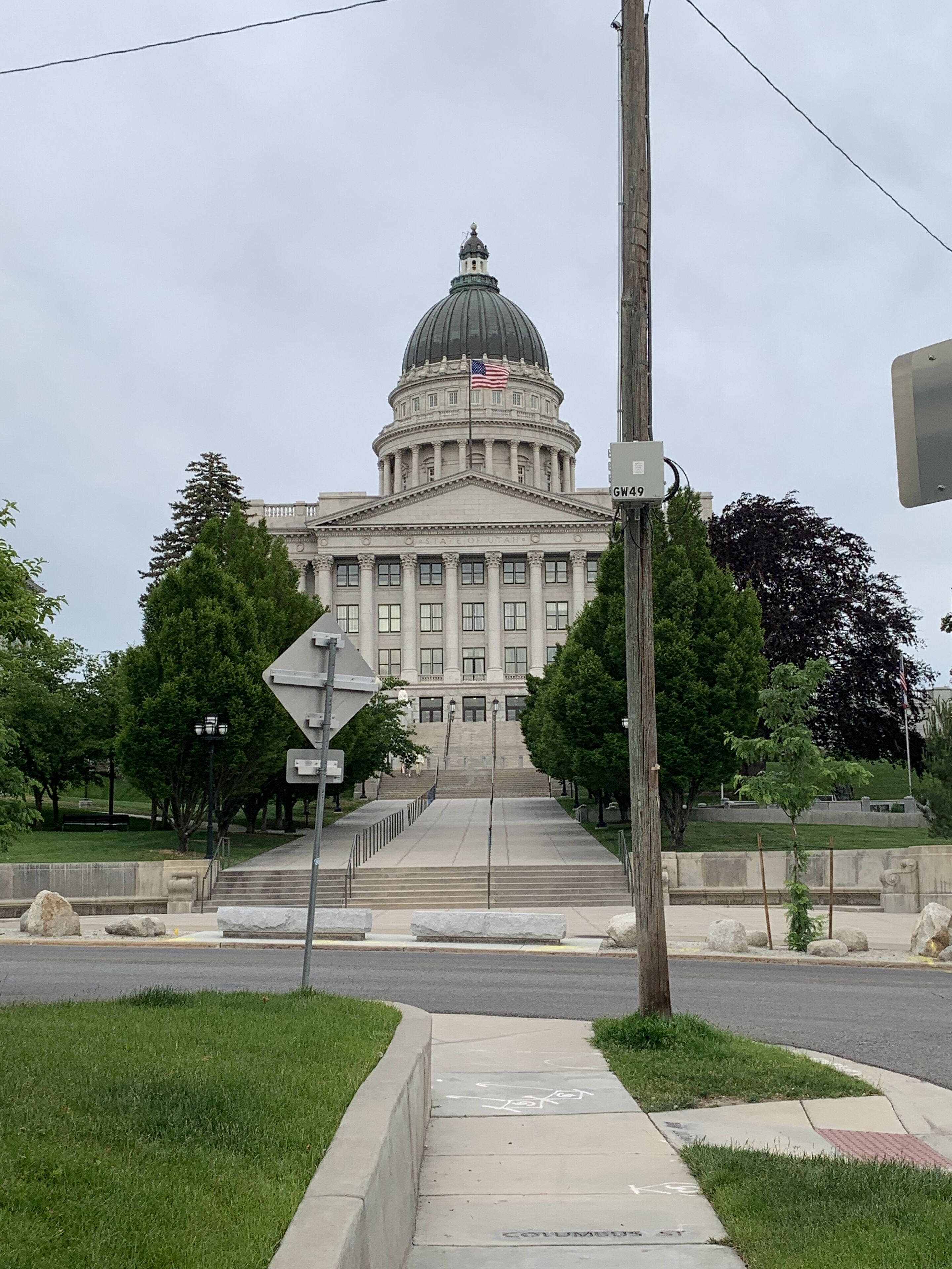 A large, classical building with a prominent dome and columns, likely a government or state capitol.